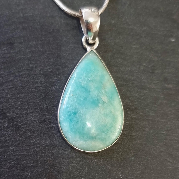 Natural Amazonite gemstone displaying soft blue-green colours with delicate white marbling.