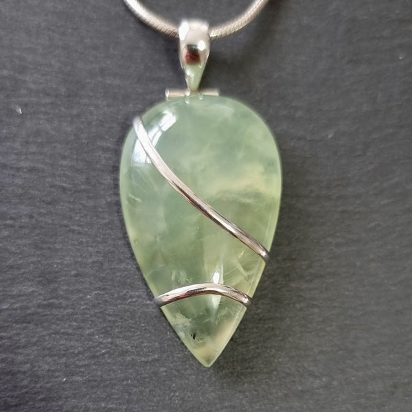 Sterling silver Prehnite jewellery featuring soft translucent green gemstones with a gentle natural glow.
