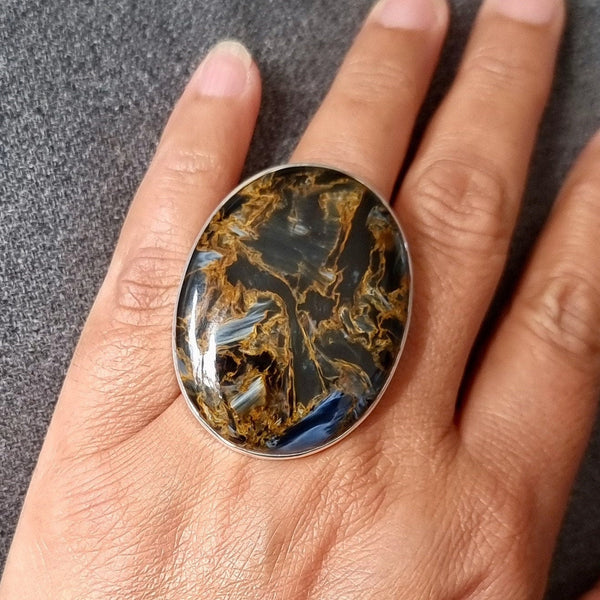 Pietersite jewellery set in 925 sterling silver featuring swirling blue, gold and brown patterns with natural chatoyancy and unique beauty