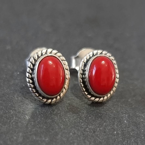 Sterling silver coral-inspired jewellery featuring vibrant red and orange gemstones.