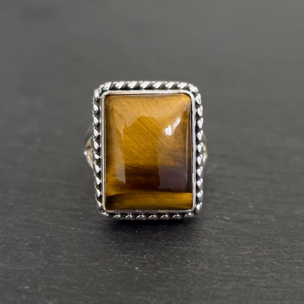 Natural Tiger's Eye sterling silver jewellery displaying rich golden-brown chatoyancy.