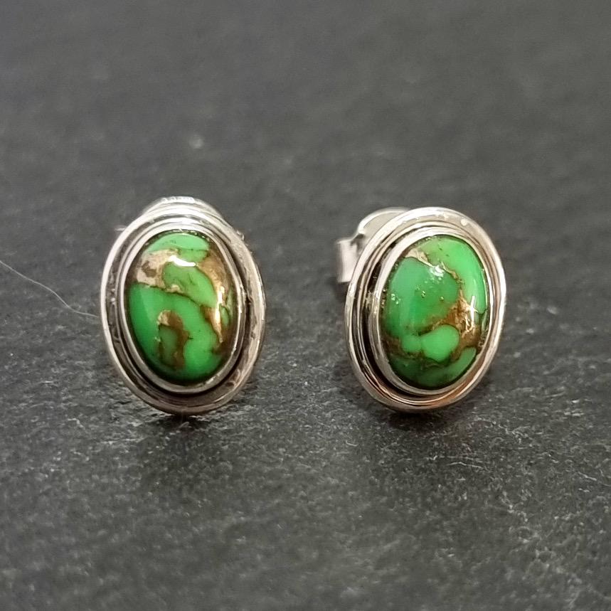 Elegant Oval Cabochon Green Copper Turquoise Stud Earrings in 925 Sterling Silver, featuring a sleek plain silver rim around the Vibrant Green gemstone, which has varied copper markings.  Stud size is Height 1.0cm x Width 0.8cm